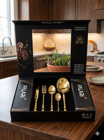 Falari 36-piece golden stainless steel cutlery set, which includes serving pieces and is presented in a black gift box.