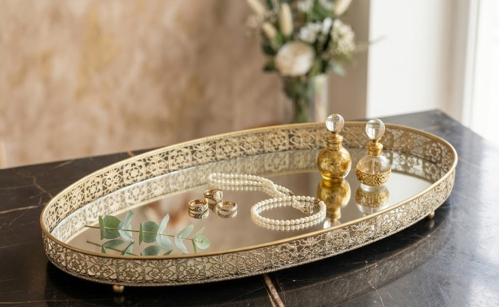 trendy handcrafted Craft Brio decorative tray features an oval glass mirror surrounded by a gold-plated filigree border.